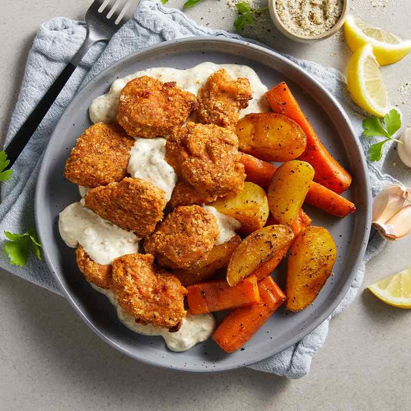 Crumbed Chicken With Roasted Vegetables And Lemon Herb Sauce My Muscle Chef 